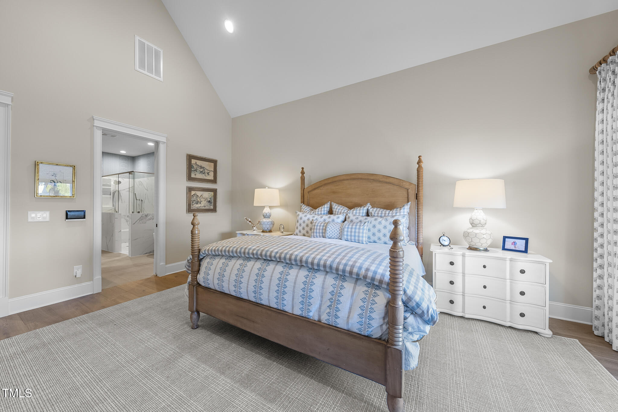 3018 Farrior Road Raleigh, NC 27607 - Photo 20 of 59 a bedroom with a bed and a cabinets