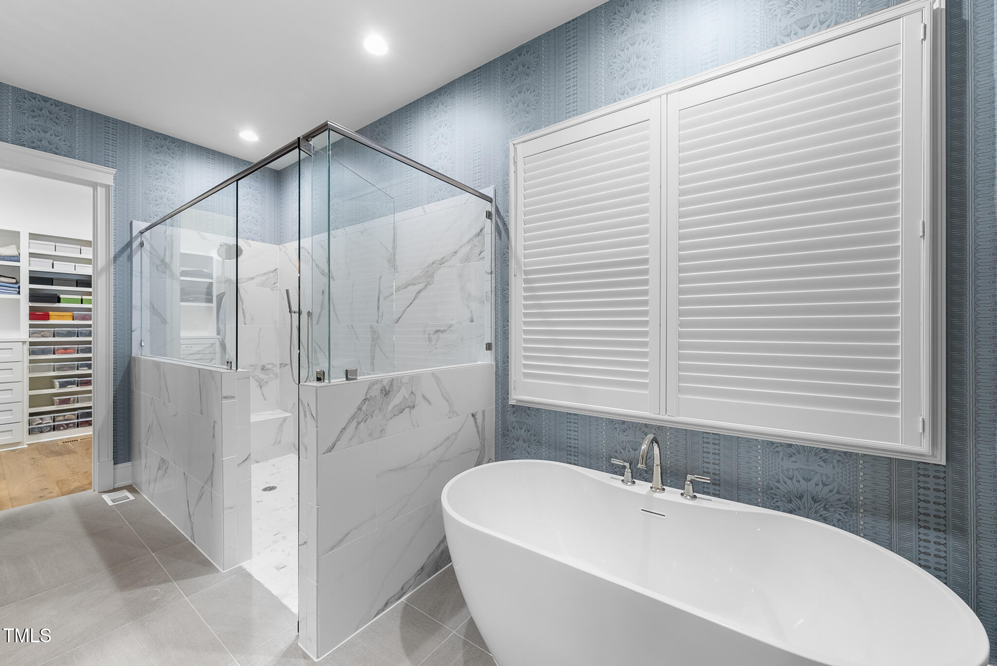 3018 Farrior Road Raleigh, NC 27607 - Photo 22 of 59 a bathroom with a bathtub and a shower