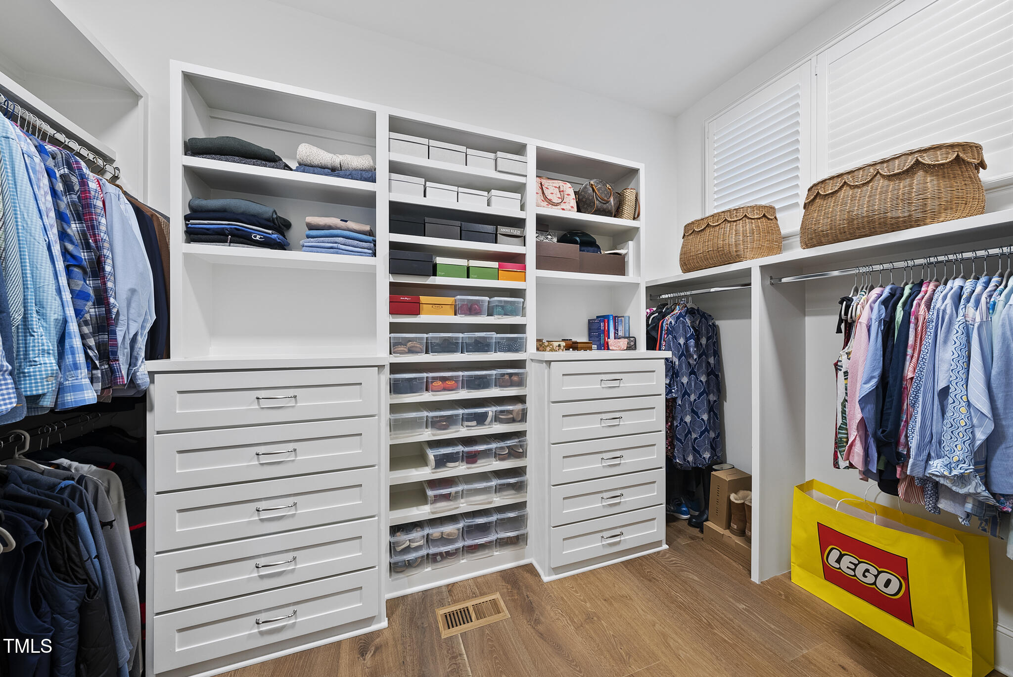 3018 Farrior Road Raleigh, NC 27607 - Photo 24 of 59 a view of walk in closet with clothes and shoes