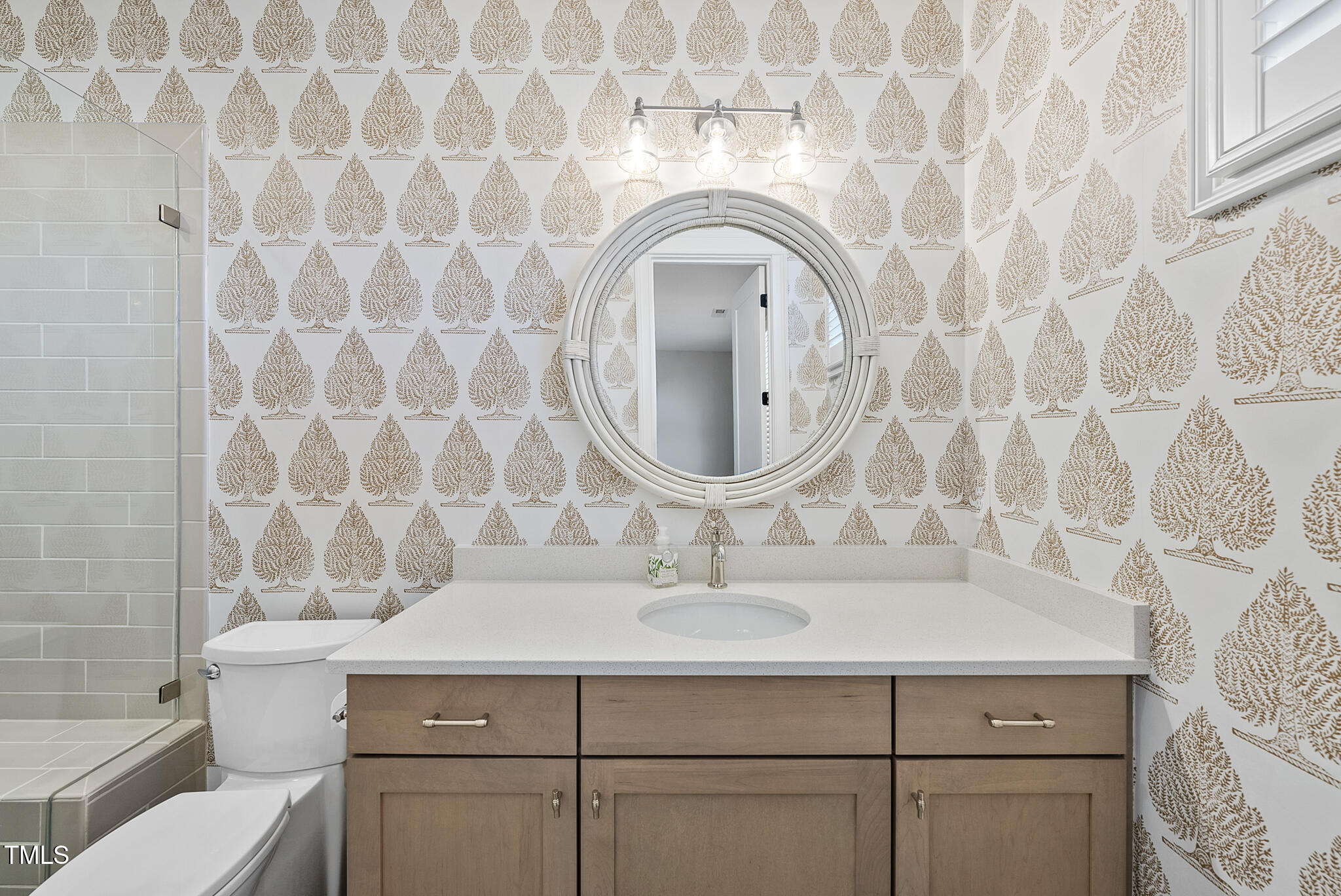 3018 Farrior Road Raleigh, NC 27607 - Photo 33 of 59 a bathroom with a sink and a mirror