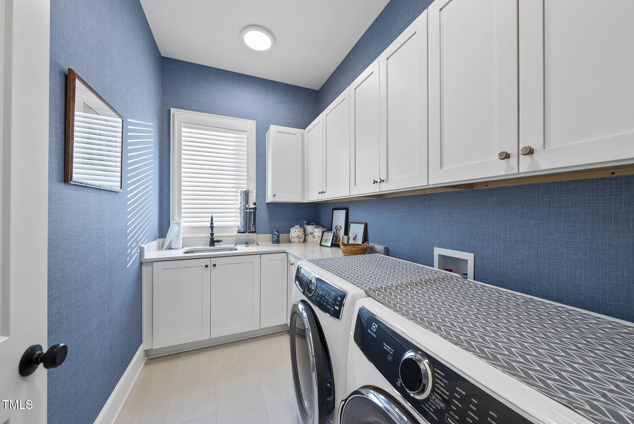 3018 Farrior Road Raleigh, NC 27607 - Photo 40 of 59 a view of a kitchen with sink cabinets and wooden floor