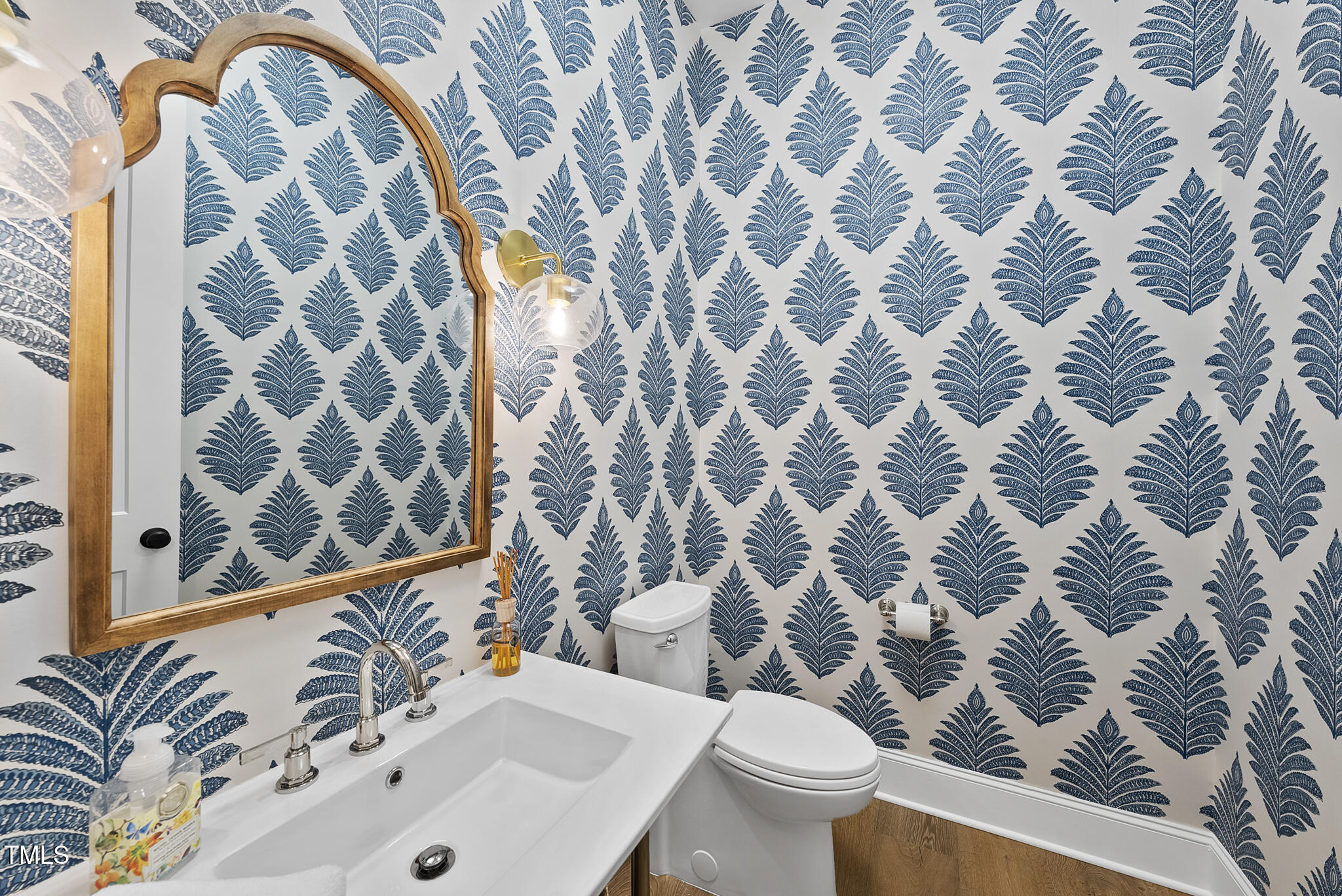 3018 Farrior Road Raleigh, NC 27607 - Photo 41 of 59 a bathroom with a sink and mirror with toilet