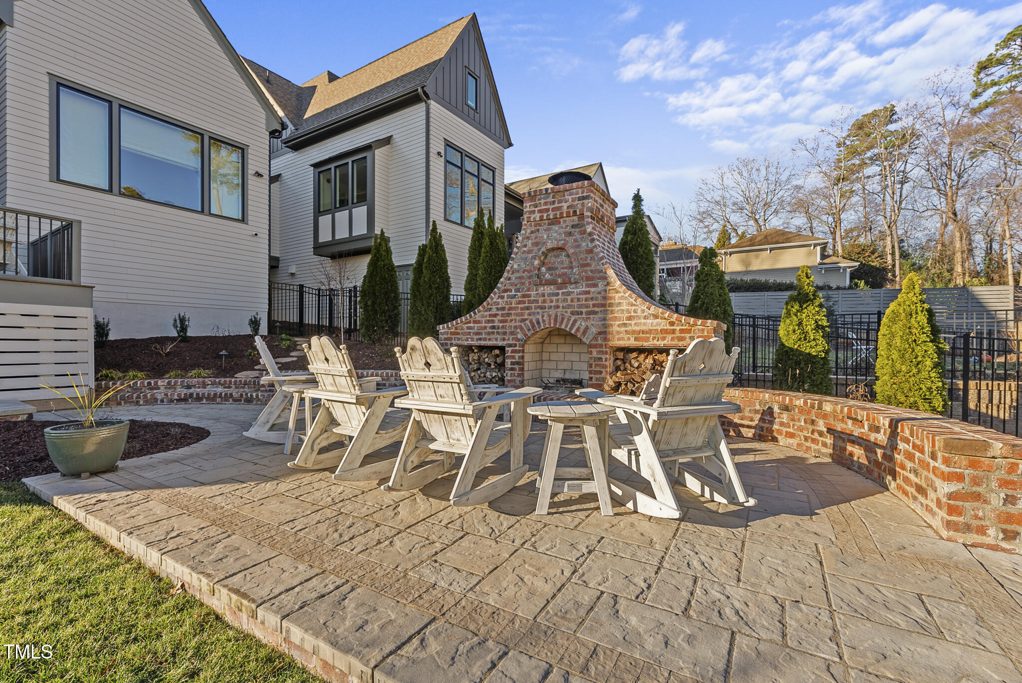 3018 Farrior Road Raleigh, NC 27607 - Photo 47 of 59 a view of a patio with dining table and chairs with wooden floor