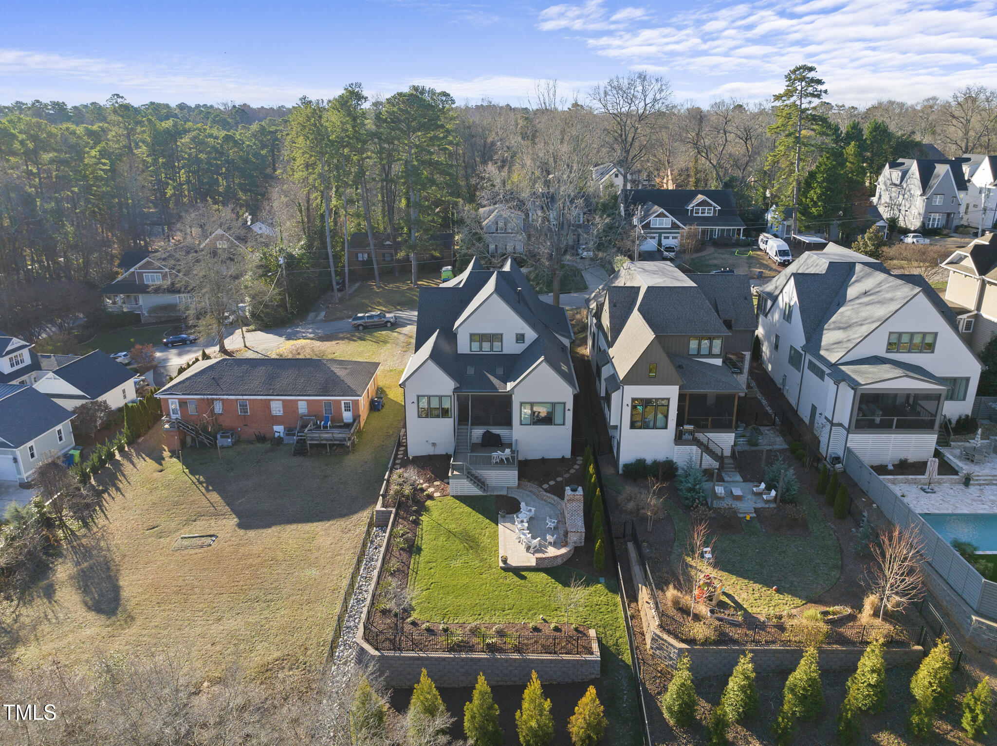 3018 Farrior Road Raleigh, NC 27607 - Photo 52 of 59 an aerial view of a house with swimming pool lawn chairs and a fire pit