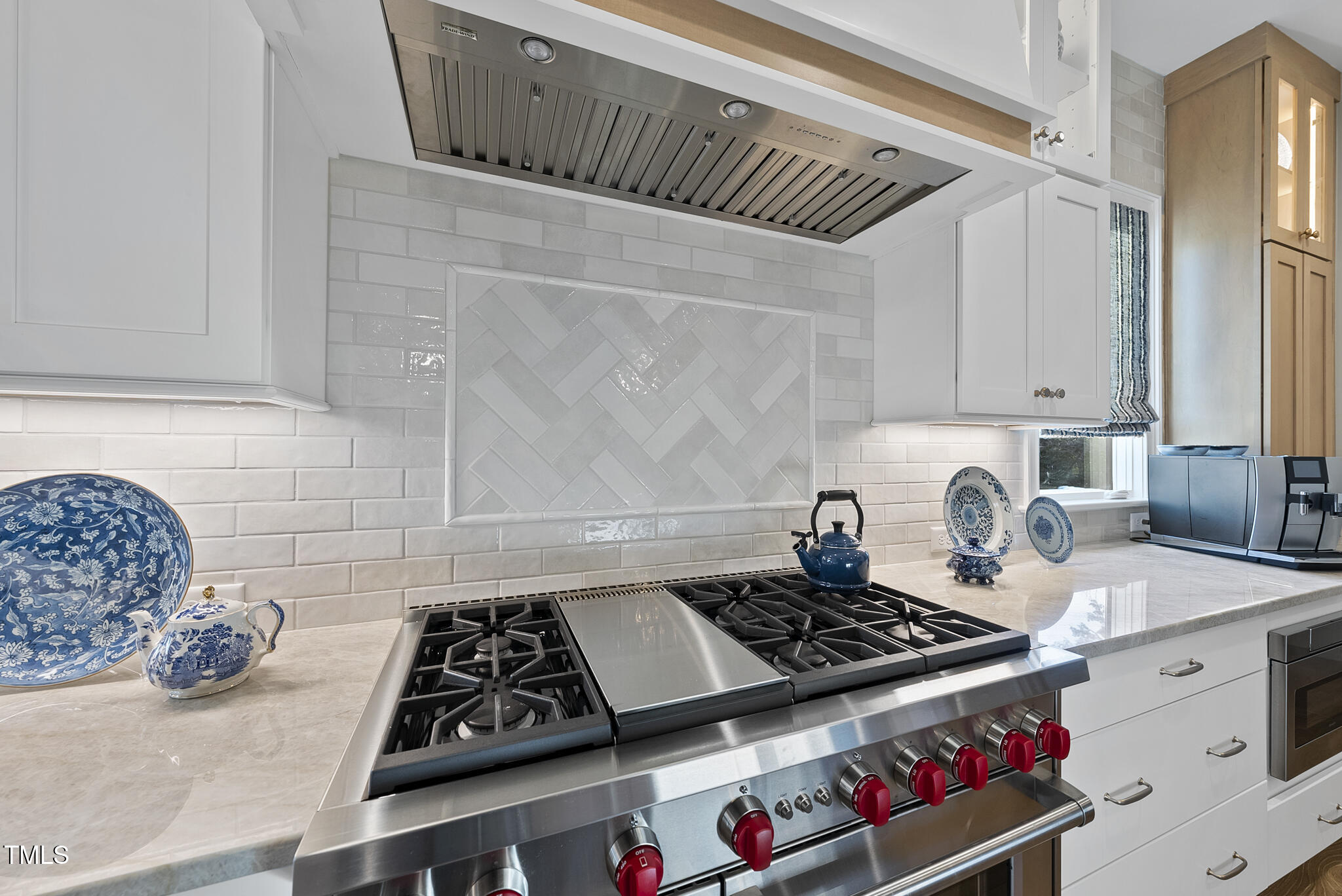 3018 Farrior Road Raleigh, NC 27607 - Photo 6 of 59 a kitchen with a stove a cabinets and wooden floor