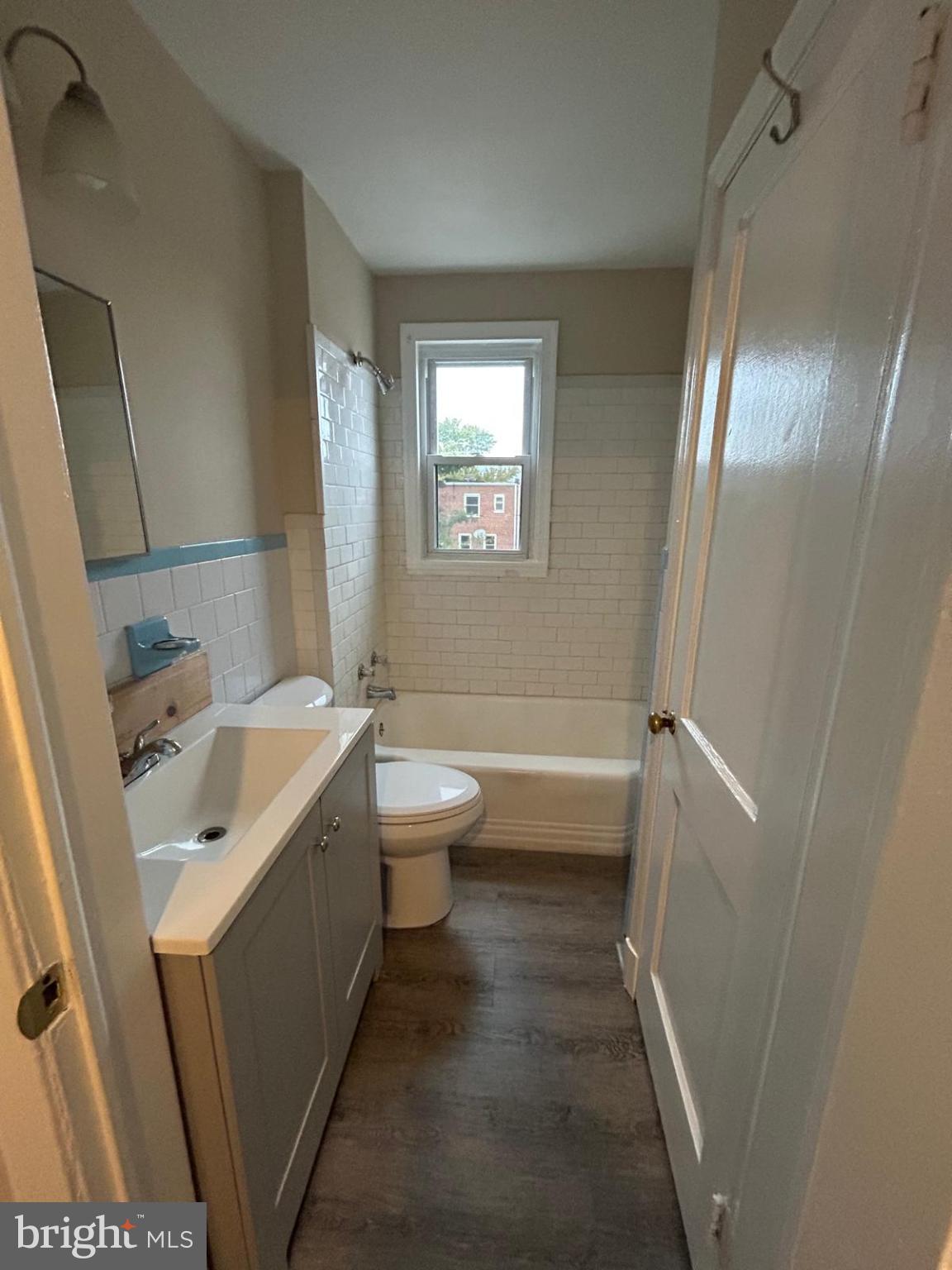 4116 Raymonn Avenue Baltimore, MD 21213 - Photo 7 of 16 a bathroom with a sink toilet and shower