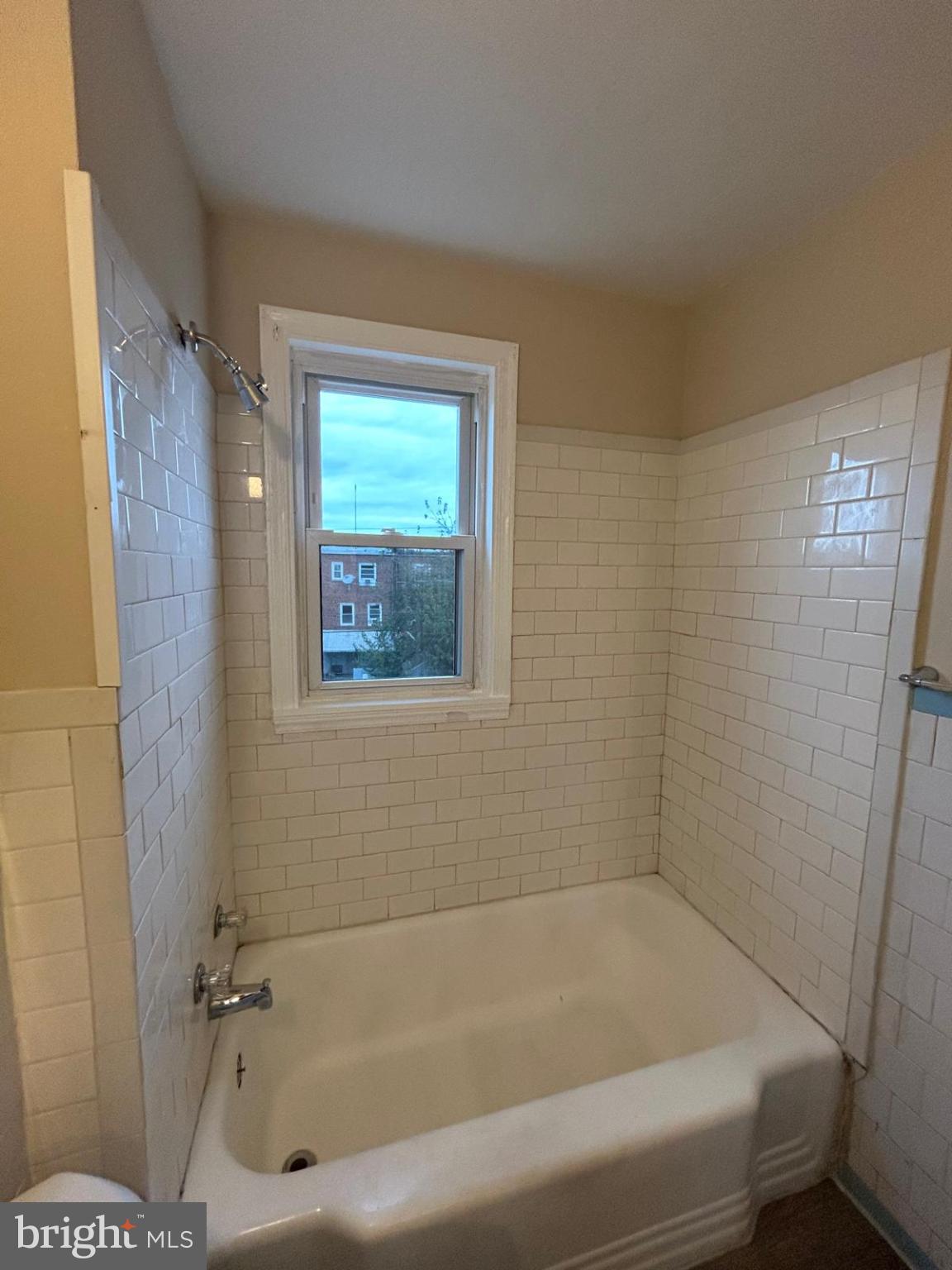 4116 Raymonn Avenue Baltimore, MD 21213 - Photo 10 of 16 a bathroom with a tub and a shower