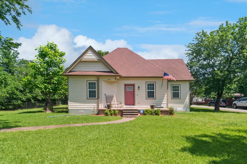 View of front of property with a shingled roof
