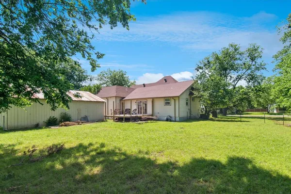 a view of a house with a big yard