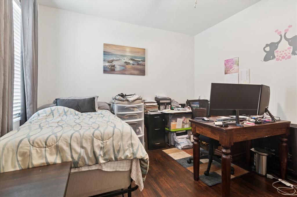 1102 West 12th Street Bonham, TX 75418 - Photo 23 of 27 Bedroom featuring dark wood-style flooring and an office area