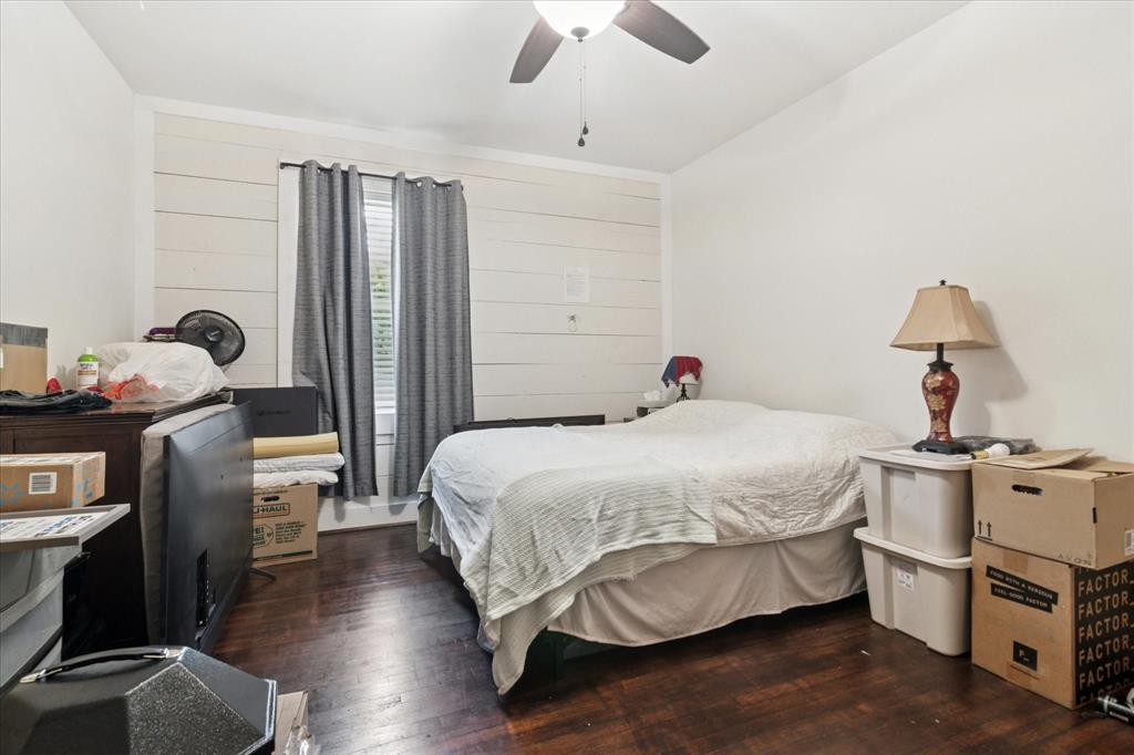 1102 West 12th Street Bonham, TX 75418 - Photo 25 of 27 Bedroom with dark wood-type flooring and a ceiling fan