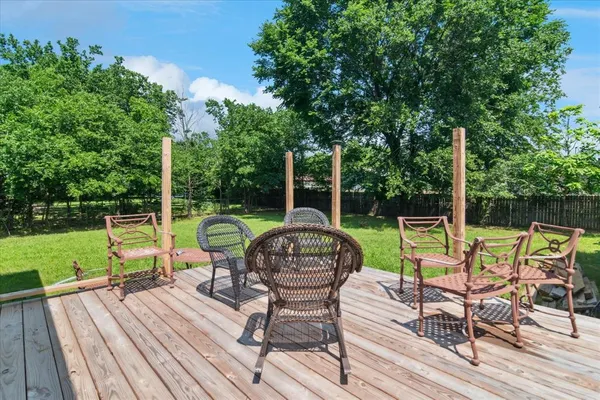 an aerial view of a house with a yard basket ball court and outdoor seating