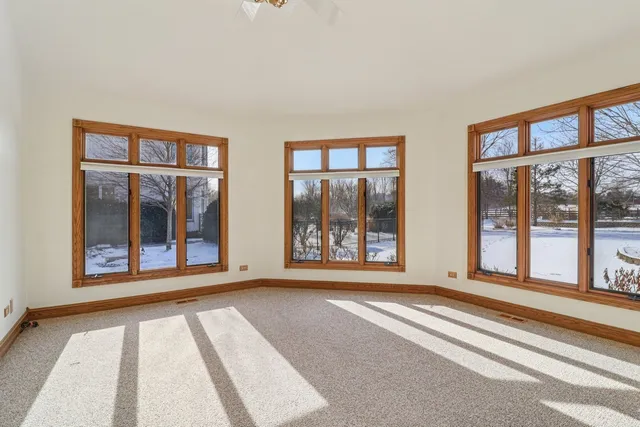 a large kitchen with stainless steel appliances kitchen island granite countertop a refrigerator and a stove top oven