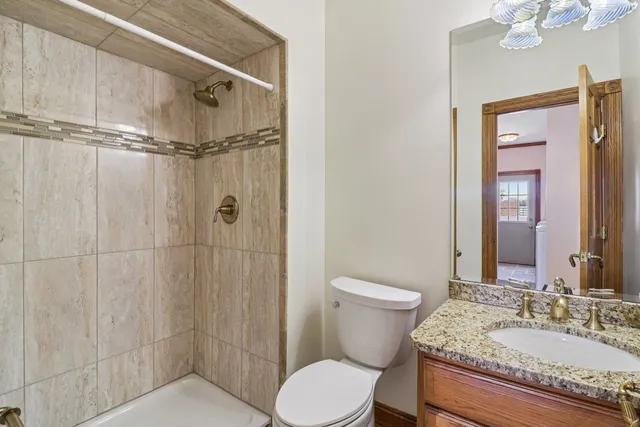 a view of a house with yard and ocean view