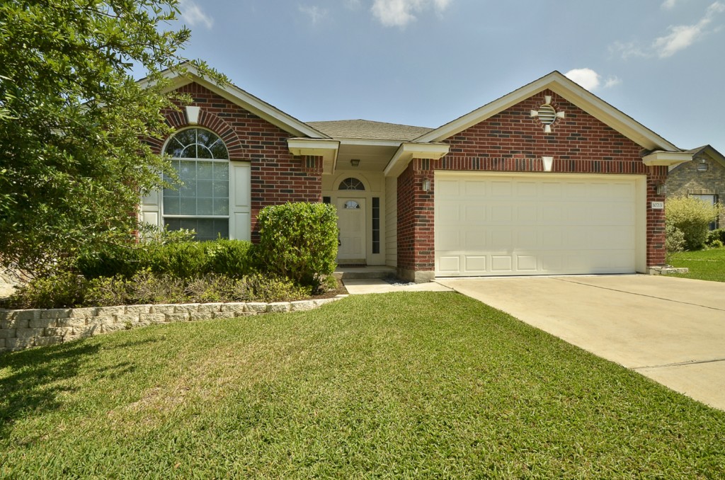 10713 Strand Street Austin, TX 78748 - Photo 1 of 1 a front view of a house with garden