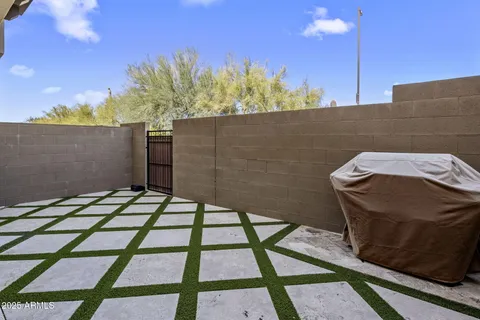 a wooden bench sitting in front of a building