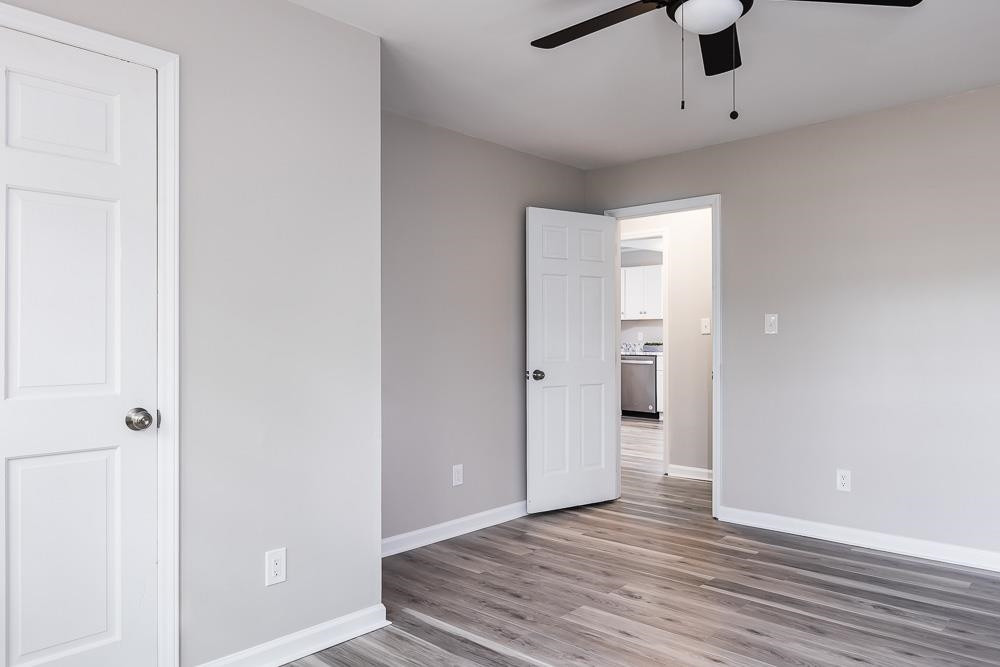 744 South Hollybrook Road Wendell, NC 27591 - Photo 13 of 30 Tucked away at the end of the hall from the family room, you have privacy. This room also has a ceiling fan. Master Bedroom