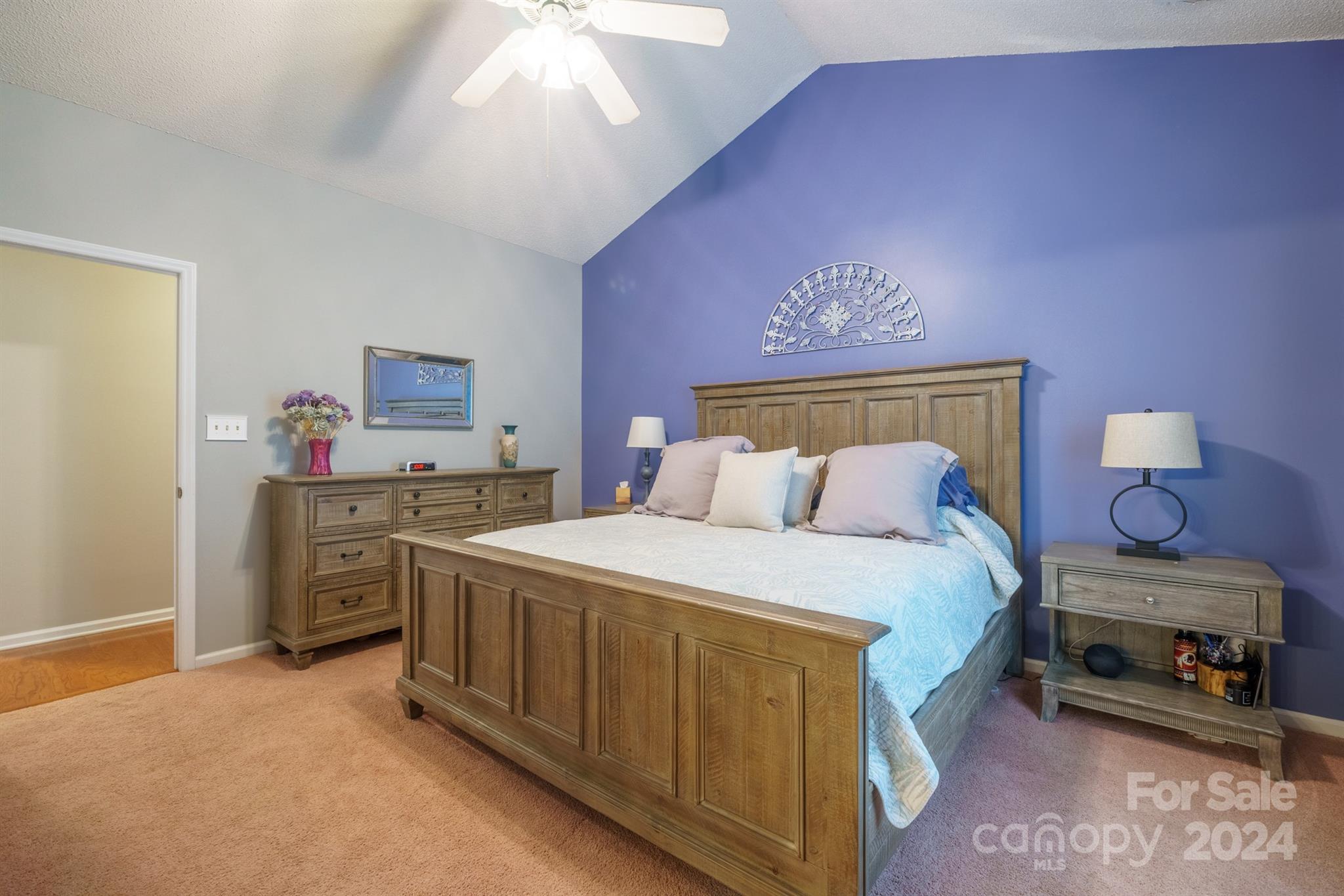 7401 Reedy Creek Road Charlotte, NC 28215 - Photo 11 of 25 a spacious bedroom with a bed and a chandelier