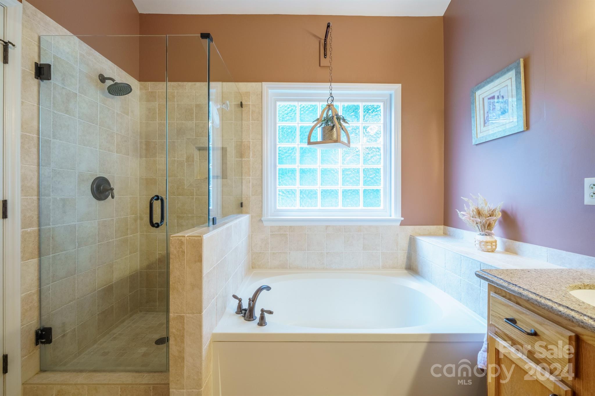 7401 Reedy Creek Road Charlotte, NC 28215 - Photo 13 of 25 a bath tub sitting next to a bathroom sink