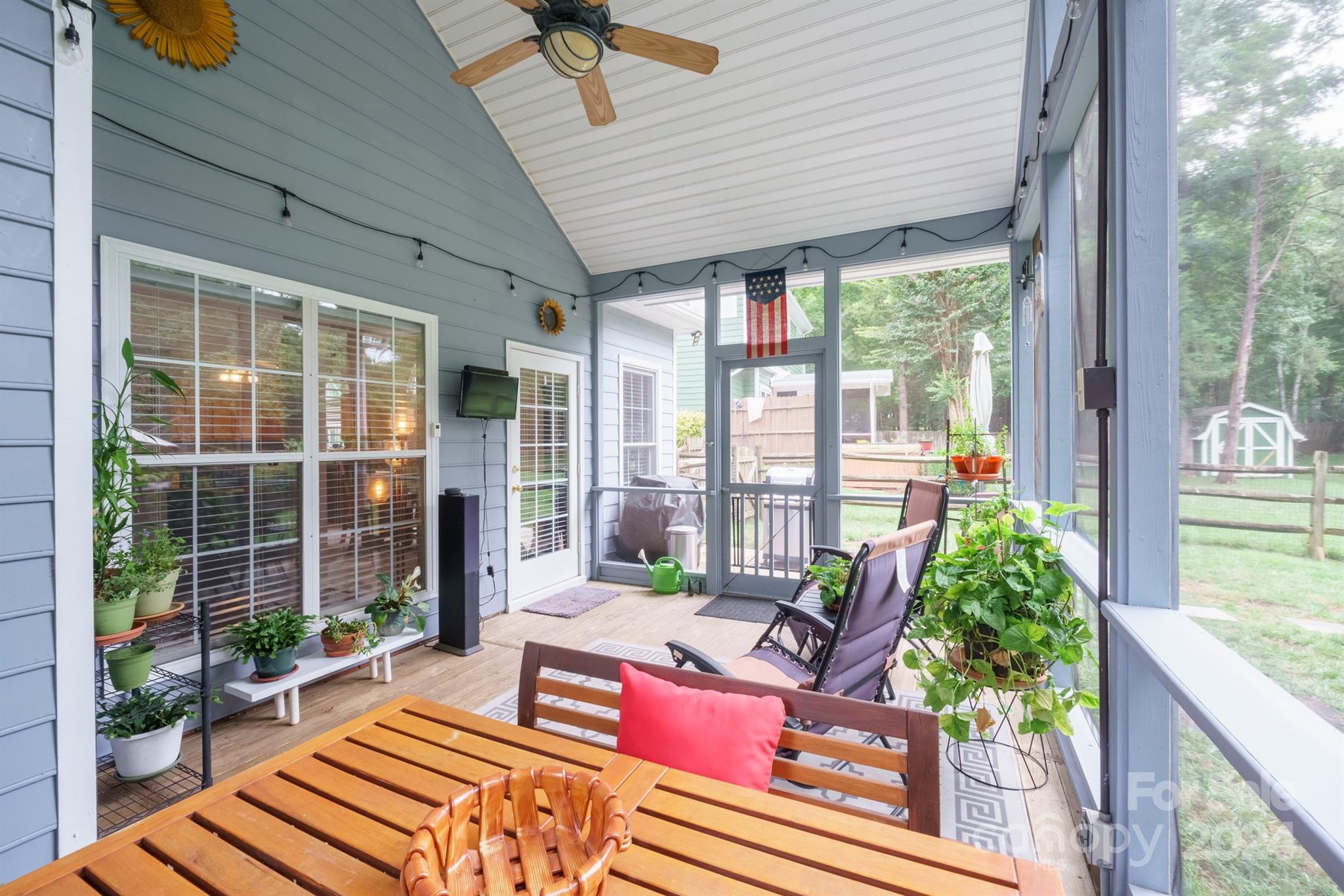 7401 Reedy Creek Road Charlotte, NC 28215 - Photo 19 of 25 a living room with patio furniture and a potted plants