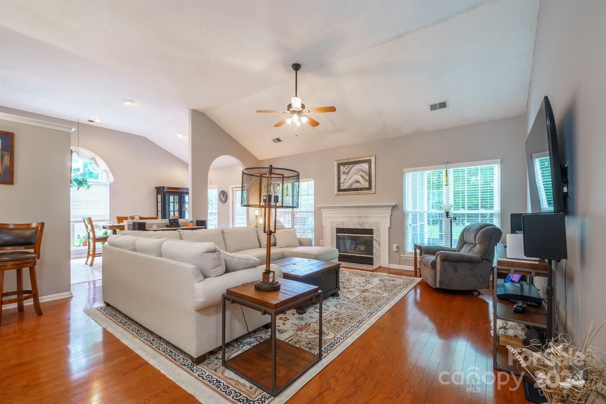 7401 Reedy Creek Road Charlotte, NC 28215 - Photo 2 of 25 a living room with furniture fireplace and a large window