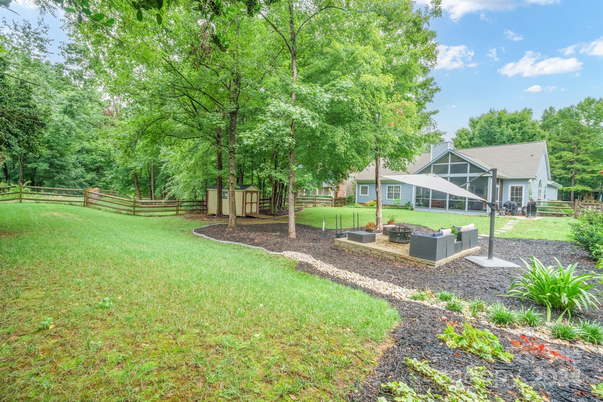7401 Reedy Creek Road Charlotte, NC 28215 - Photo 24 of 25 a view of a house with backyard and a tree