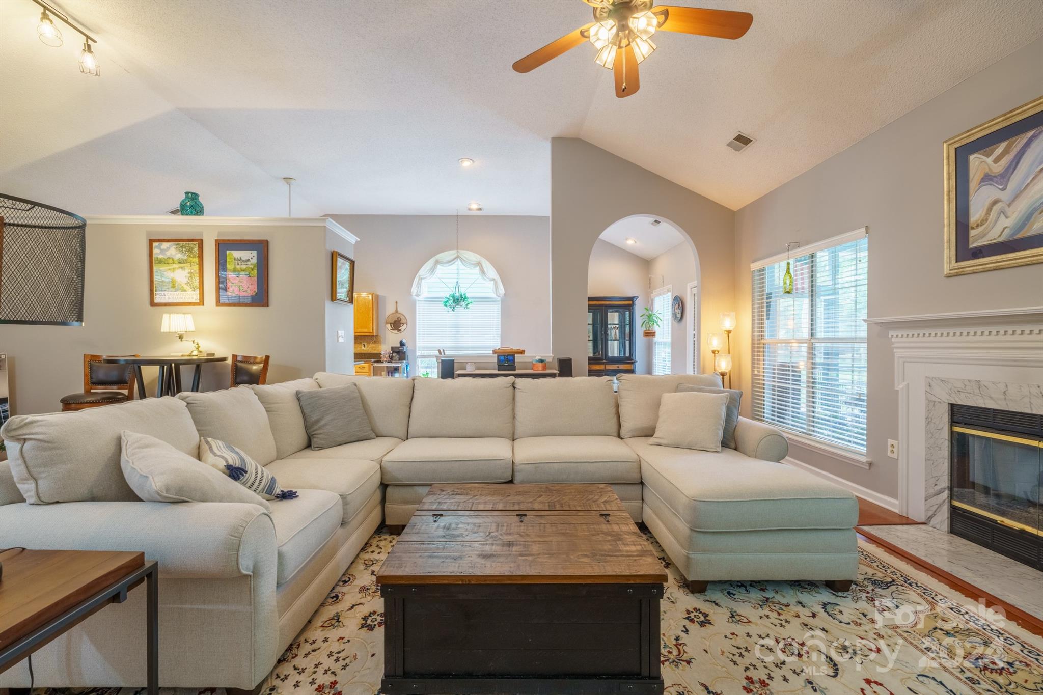 7401 Reedy Creek Road Charlotte, NC 28215 - Photo 3 of 25 a living room with furniture and a fireplace