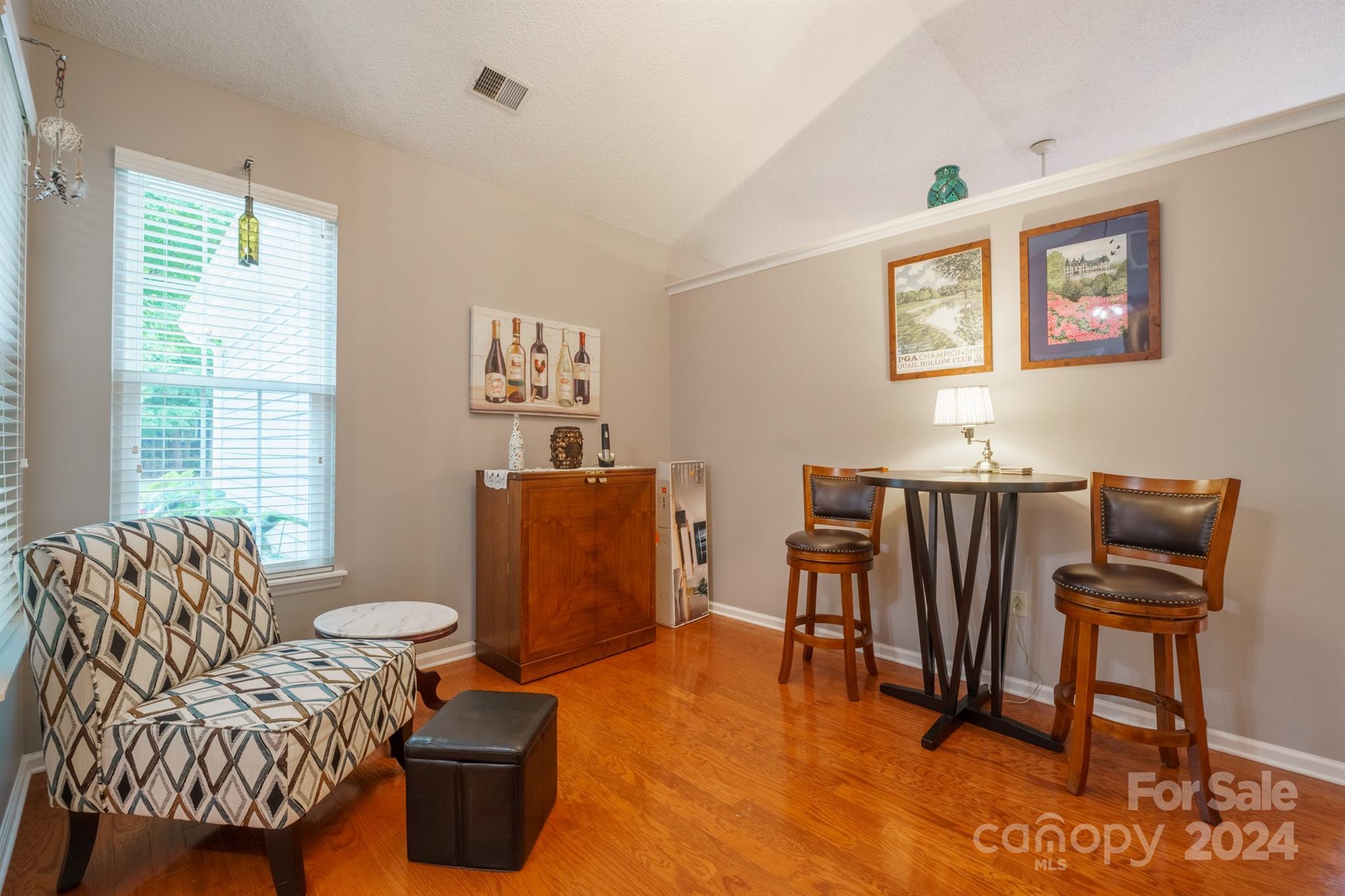 7401 Reedy Creek Road Charlotte, NC 28215 - Photo 5 of 25 a living room with furniture a rug and a large window