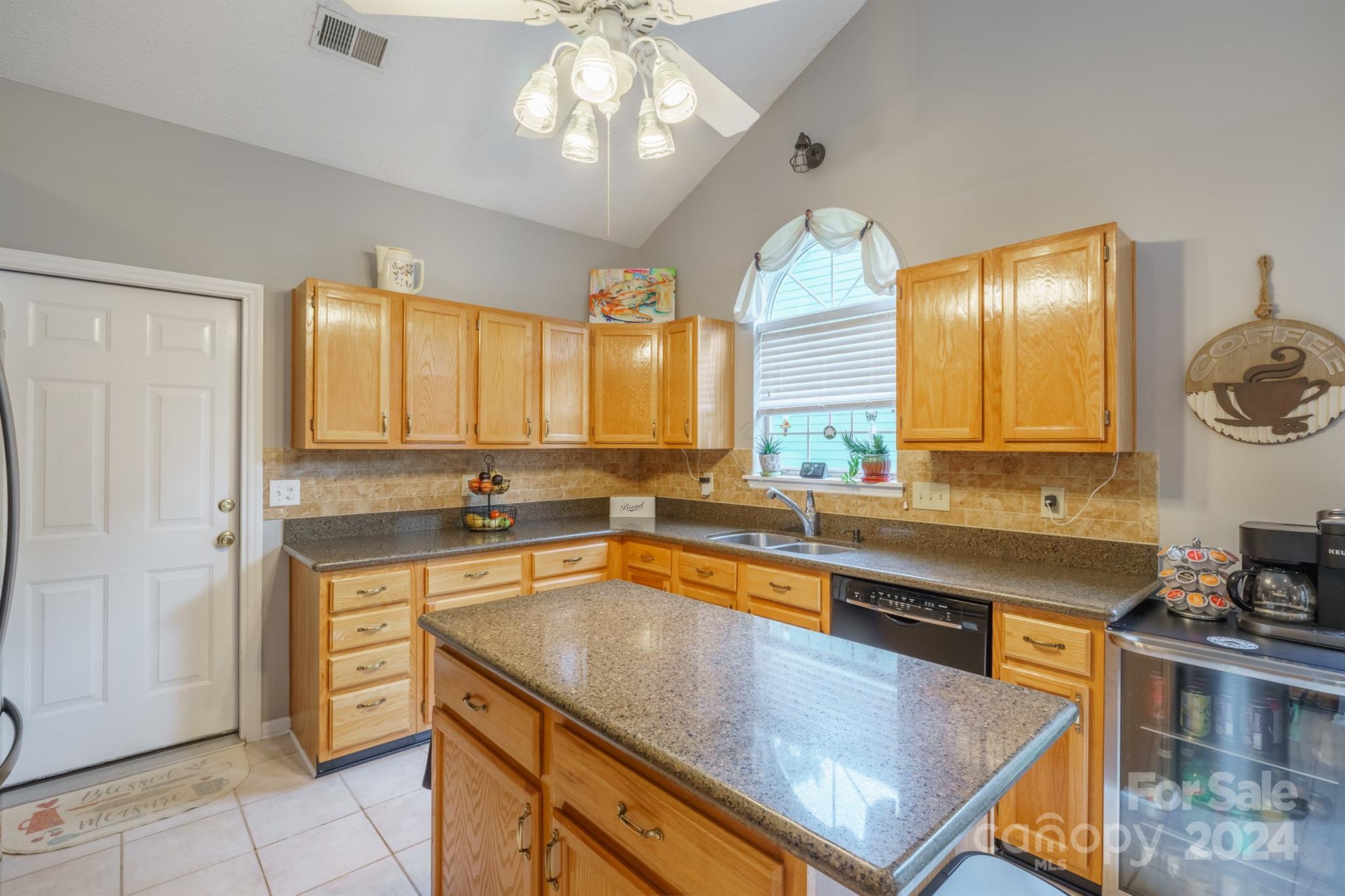 7401 Reedy Creek Road Charlotte, NC 28215 - Photo 7 of 25 a kitchen with a stove a sink and a refrigerator