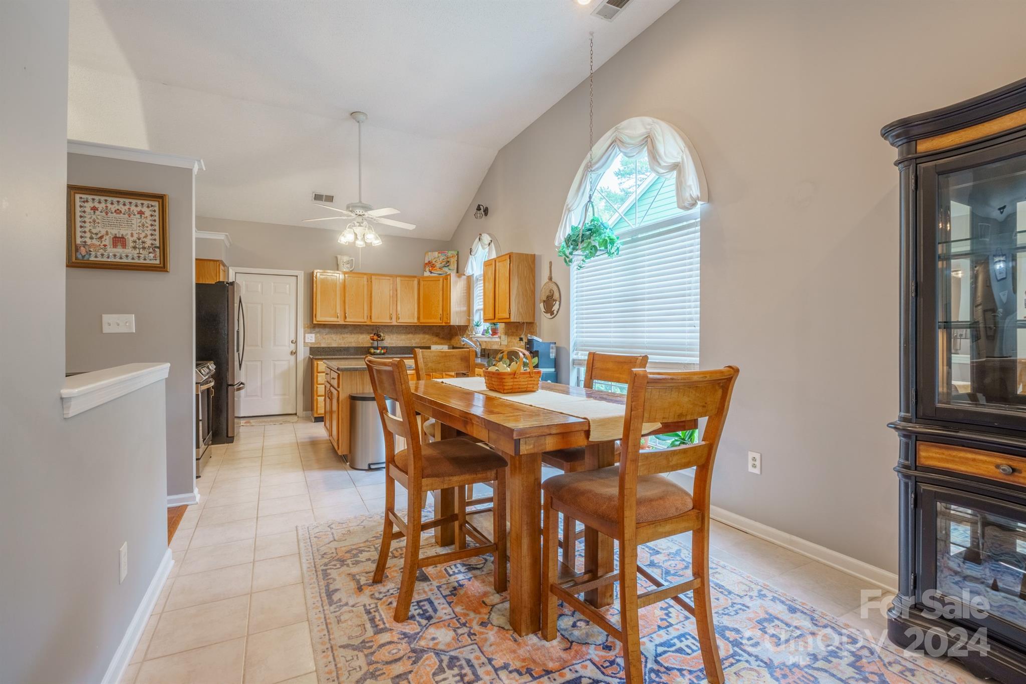 7401 Reedy Creek Road Charlotte, NC 28215 - Photo 10 of 25 a view of a dining room with furniture window and wooden floor