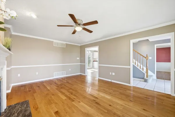 a kitchen with a stove a sink and a granite counter tops