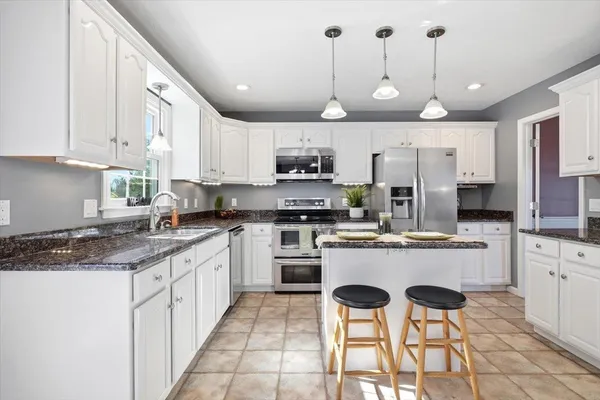 a bed room with bed and a potted plant