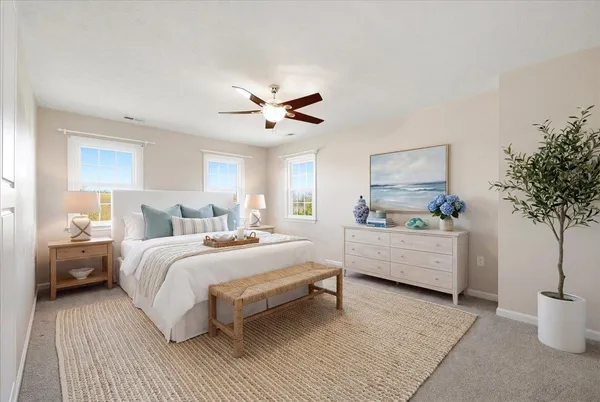 an empty room with closet and windows