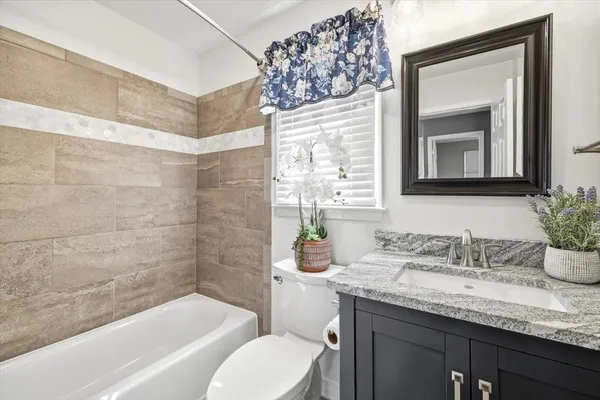 an aerial view of a house with yard swimming pool and outdoor seating