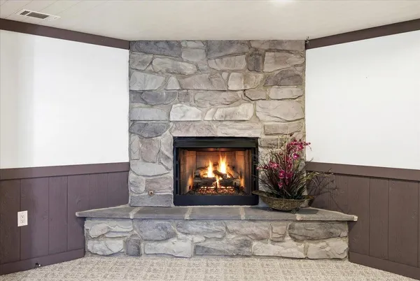 a view of a house with a yard and deck