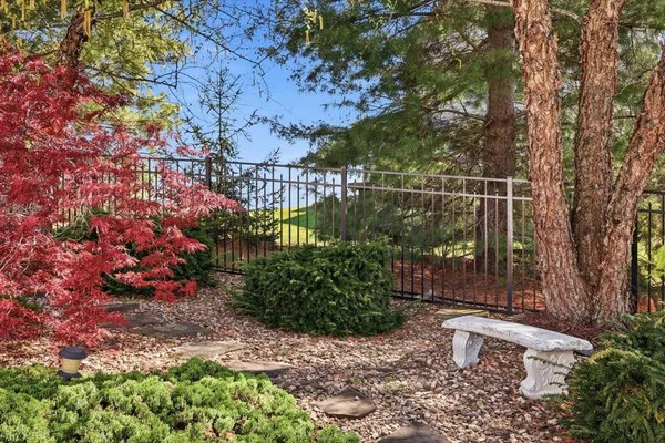 a view of a house with brick walls and a garden
