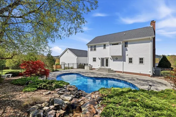 a living room with a fireplace and a fireplace