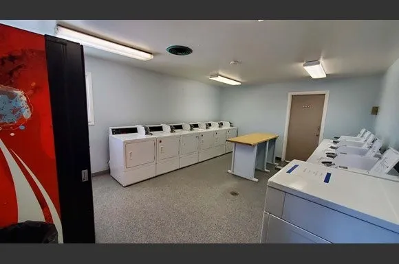a room with furniture and air hockey table