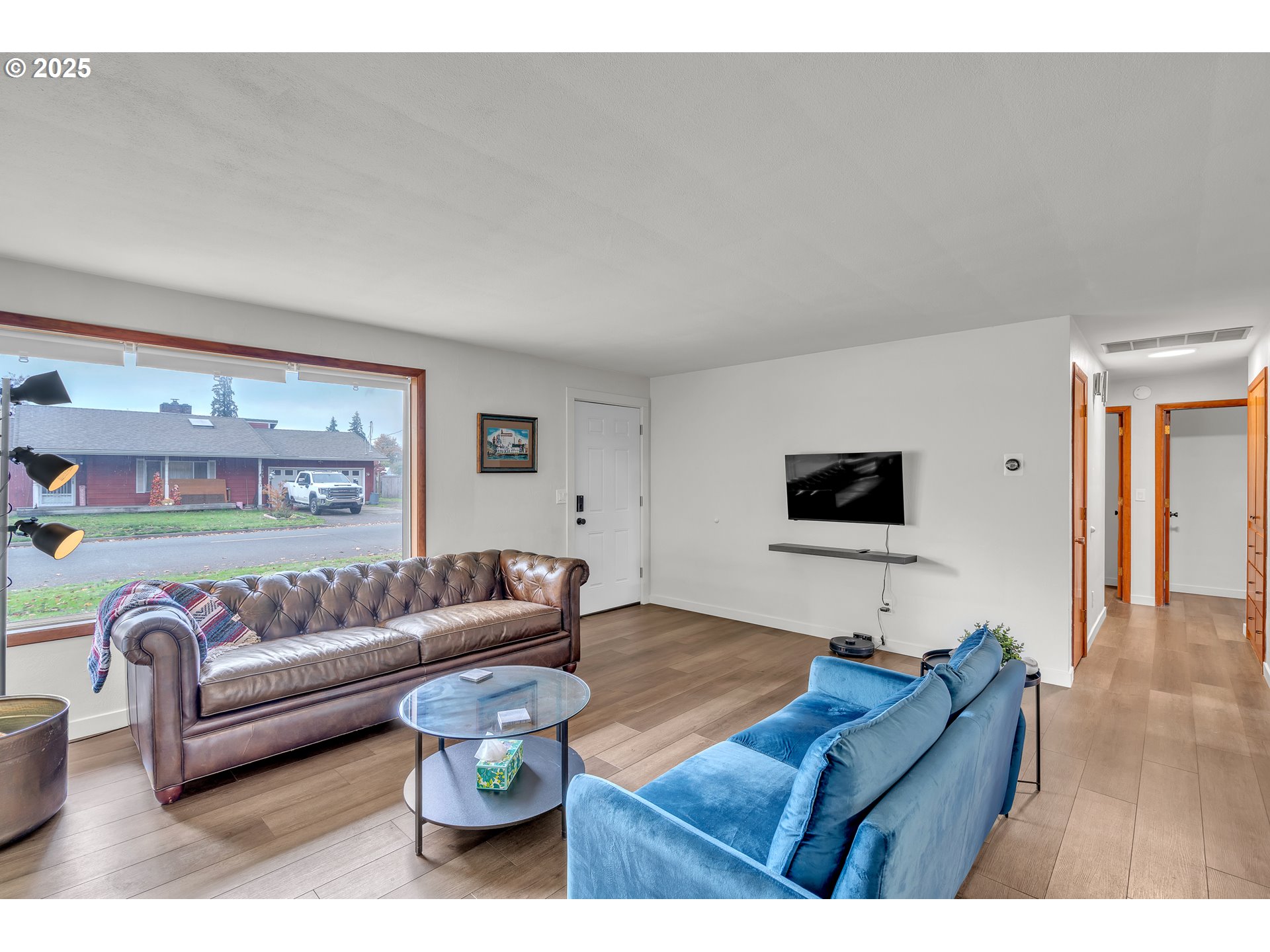 3472 Hoodview Drive Hubbard, OR 97032 - Photo 3 of 23 a living room with furniture and a flat screen tv
