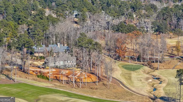 an aerial view of residential building and trees around
