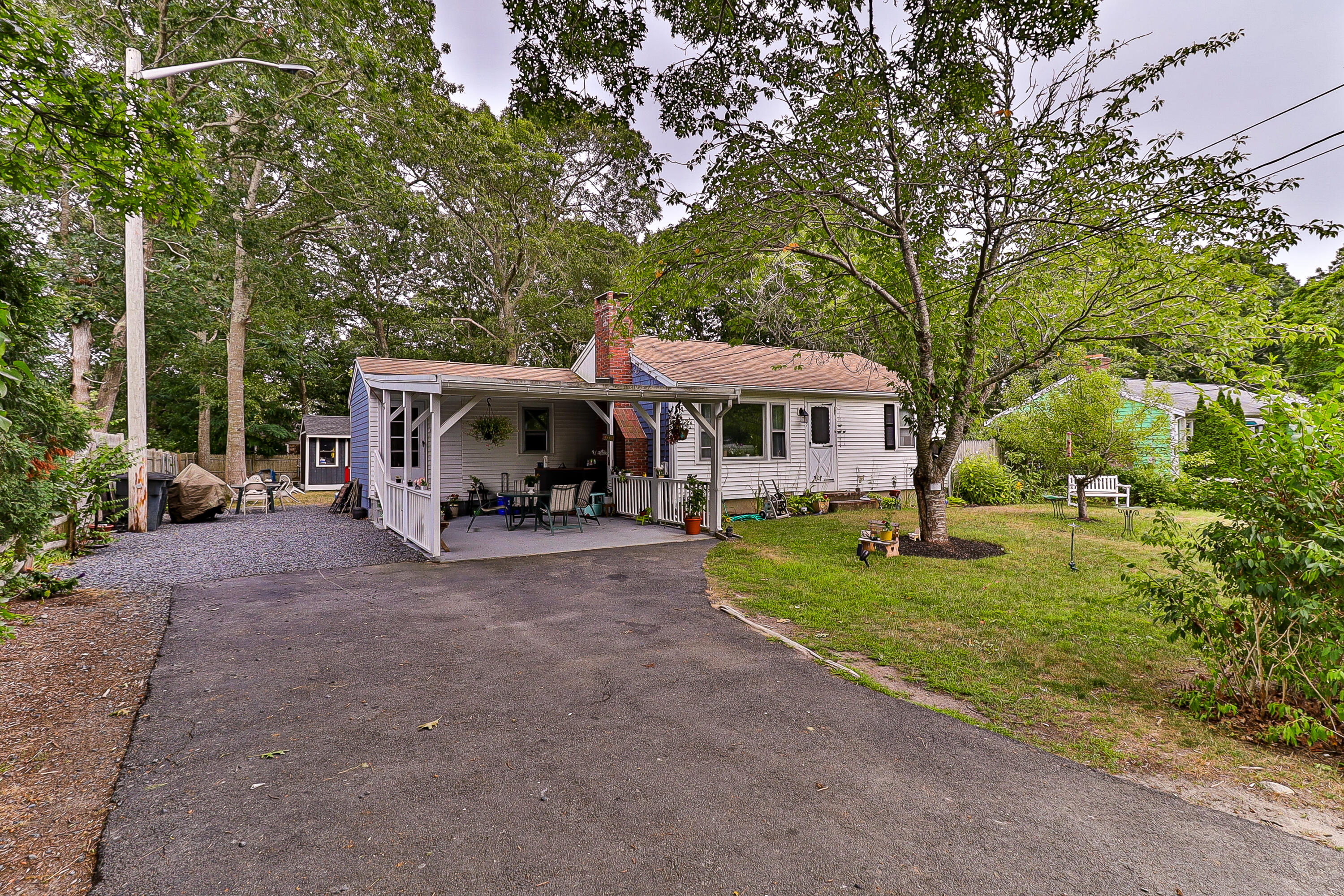 440 Lincoln Rd Extension Barnstable, MA 02601 - Photo 1 of 19 a front view of a house with garden