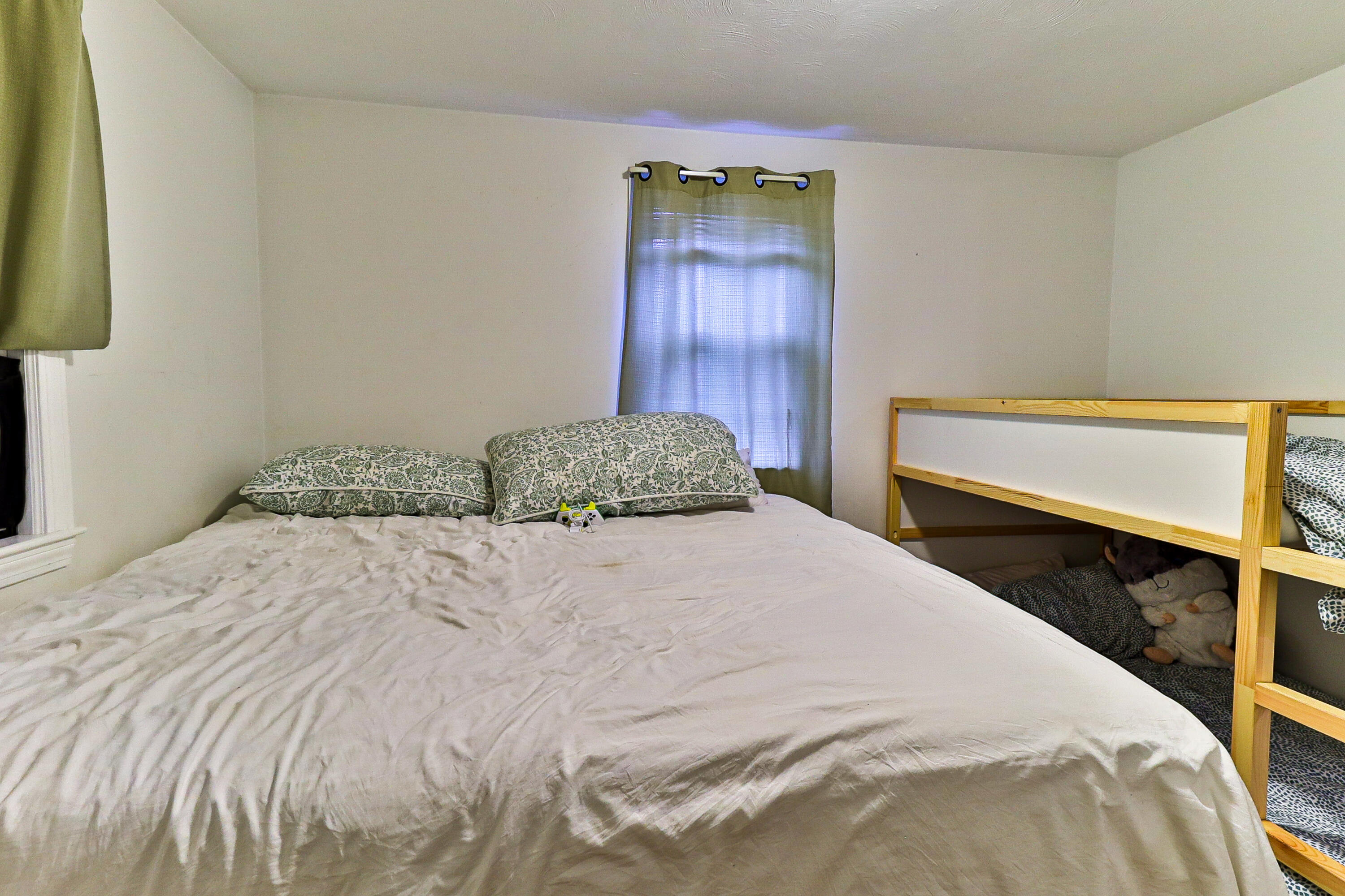 440 Lincoln Rd Extension Barnstable, MA 02601 - Photo 13 of 19 a bedroom with a bed and a night stand