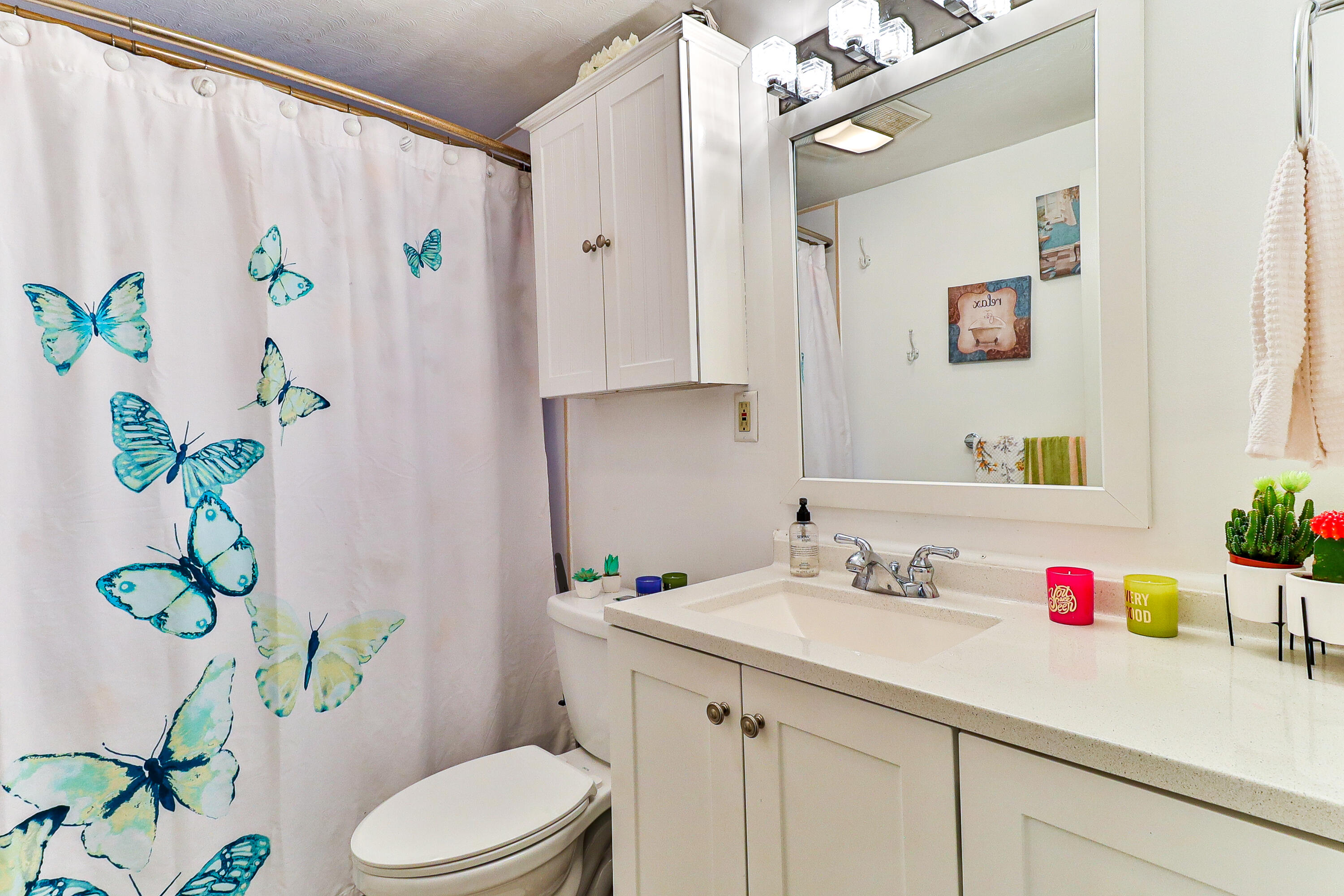 440 Lincoln Rd Extension Barnstable, MA 02601 - Photo 15 of 19 a bathroom with a sink a toilet and a shower curtain