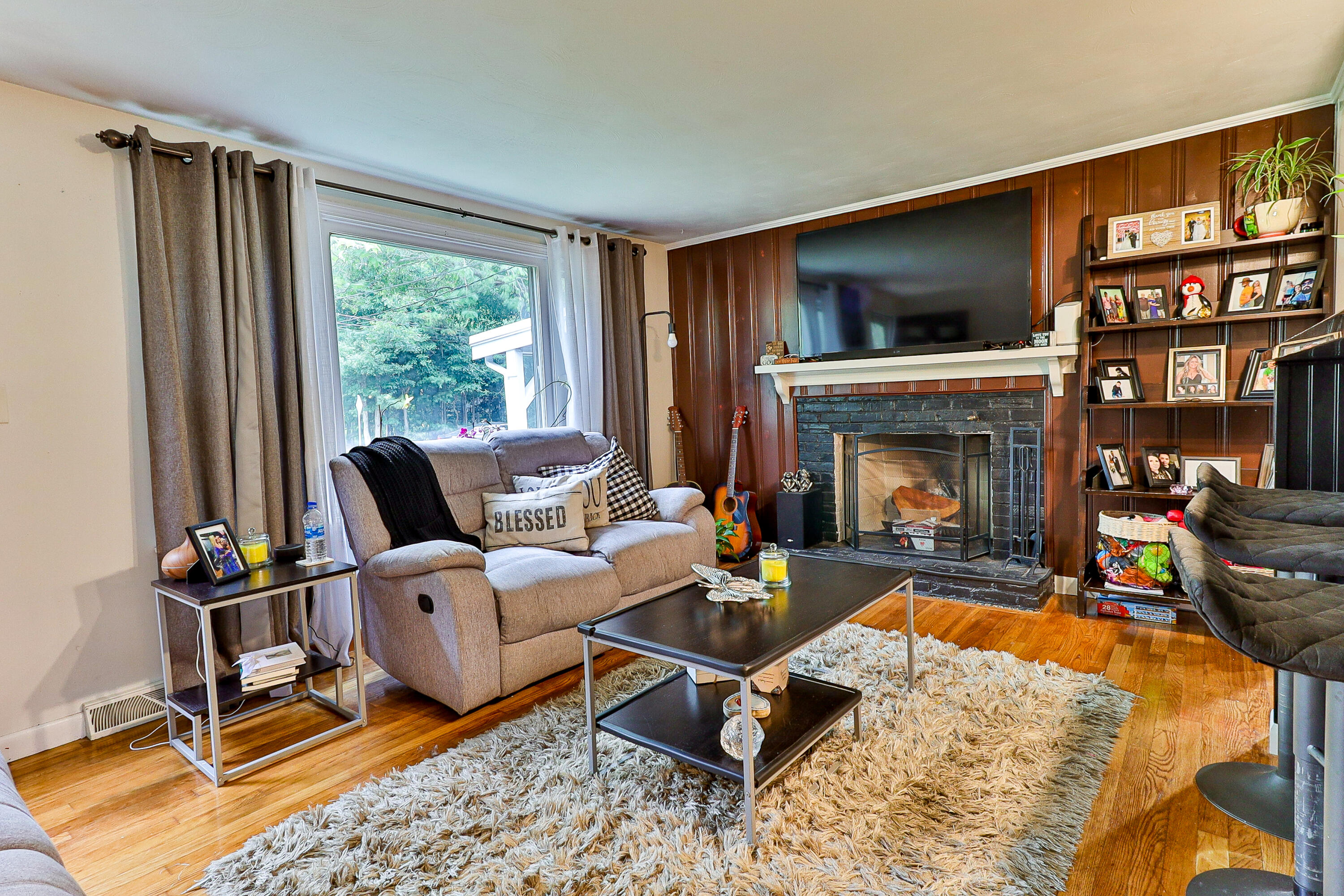 440 Lincoln Rd Extension Barnstable, MA 02601 - Photo 3 of 19 a living room with furniture a window and a fireplace