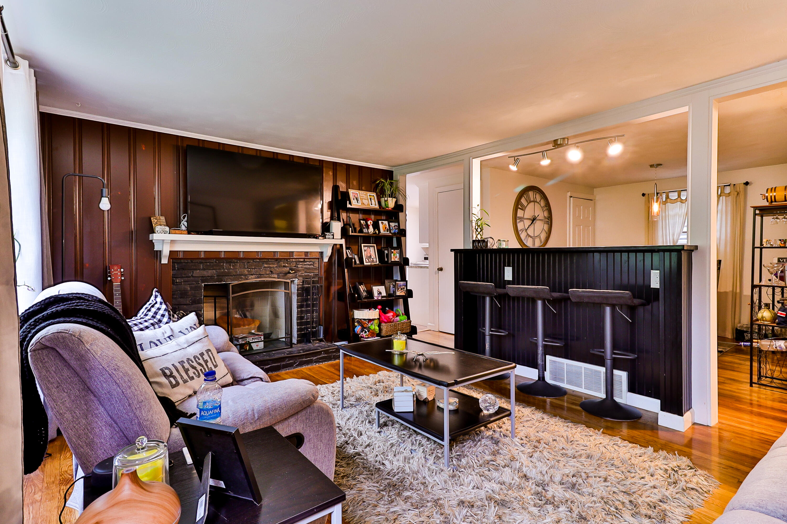 440 Lincoln Rd Extension Barnstable, MA 02601 - Photo 4 of 19 a living room with furniture a flat screen tv and a fireplace