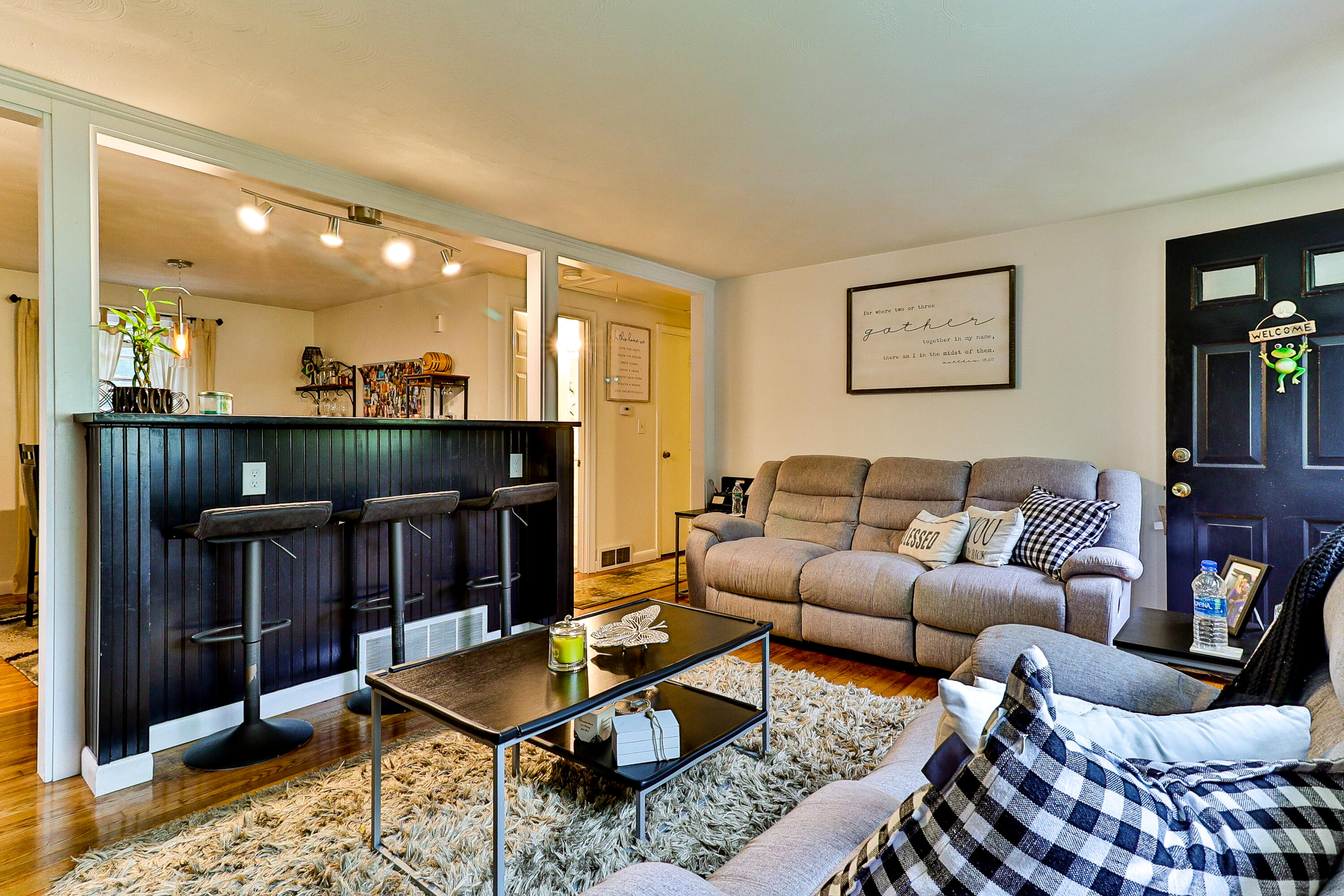 440 Lincoln Rd Extension Barnstable, MA 02601 - Photo 5 of 19 a living room with furniture and a fireplace