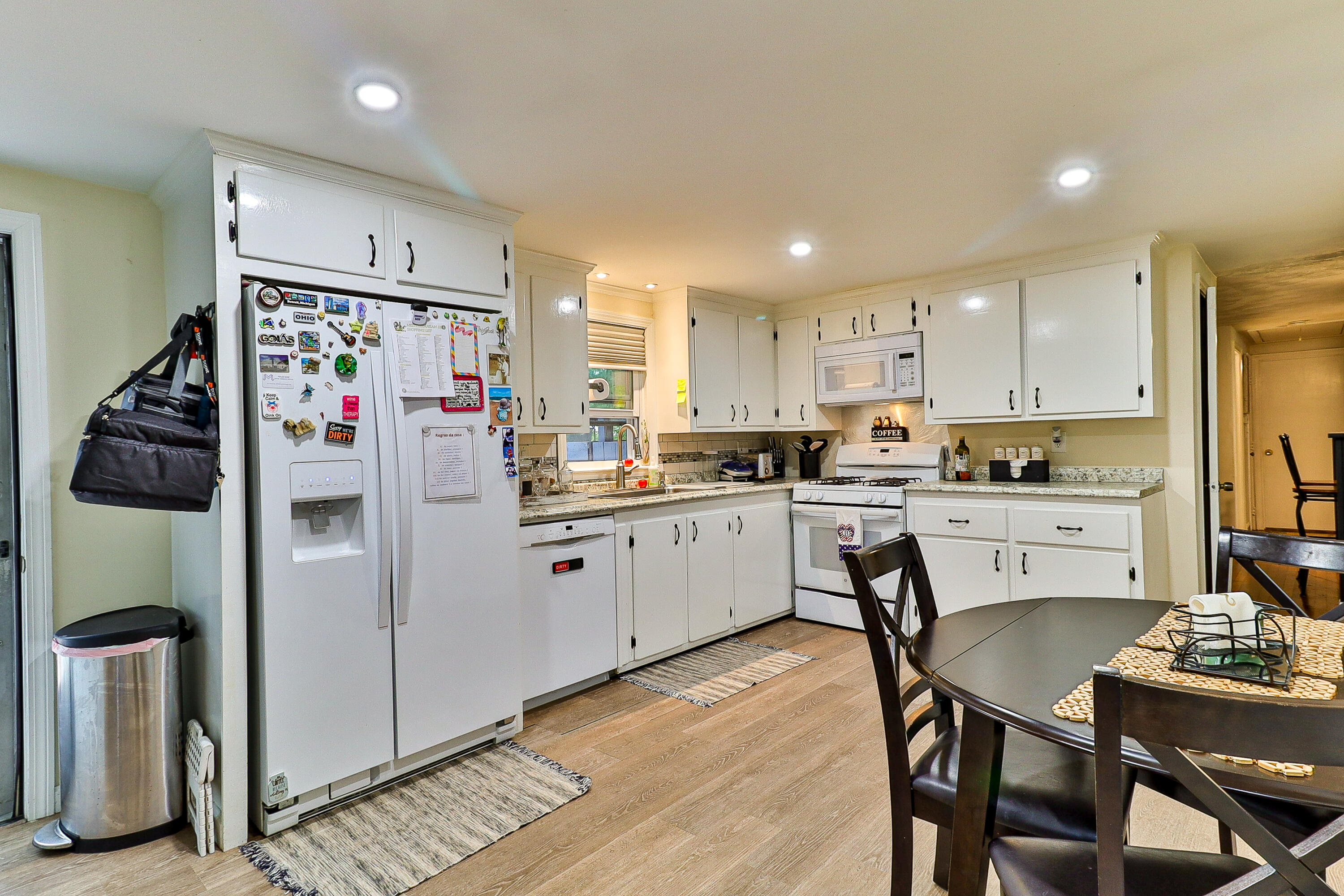 440 Lincoln Rd Extension Barnstable, MA 02601 - Photo 6 of 19 a kitchen with stainless steel appliances refrigerator stove microwave and cabinets