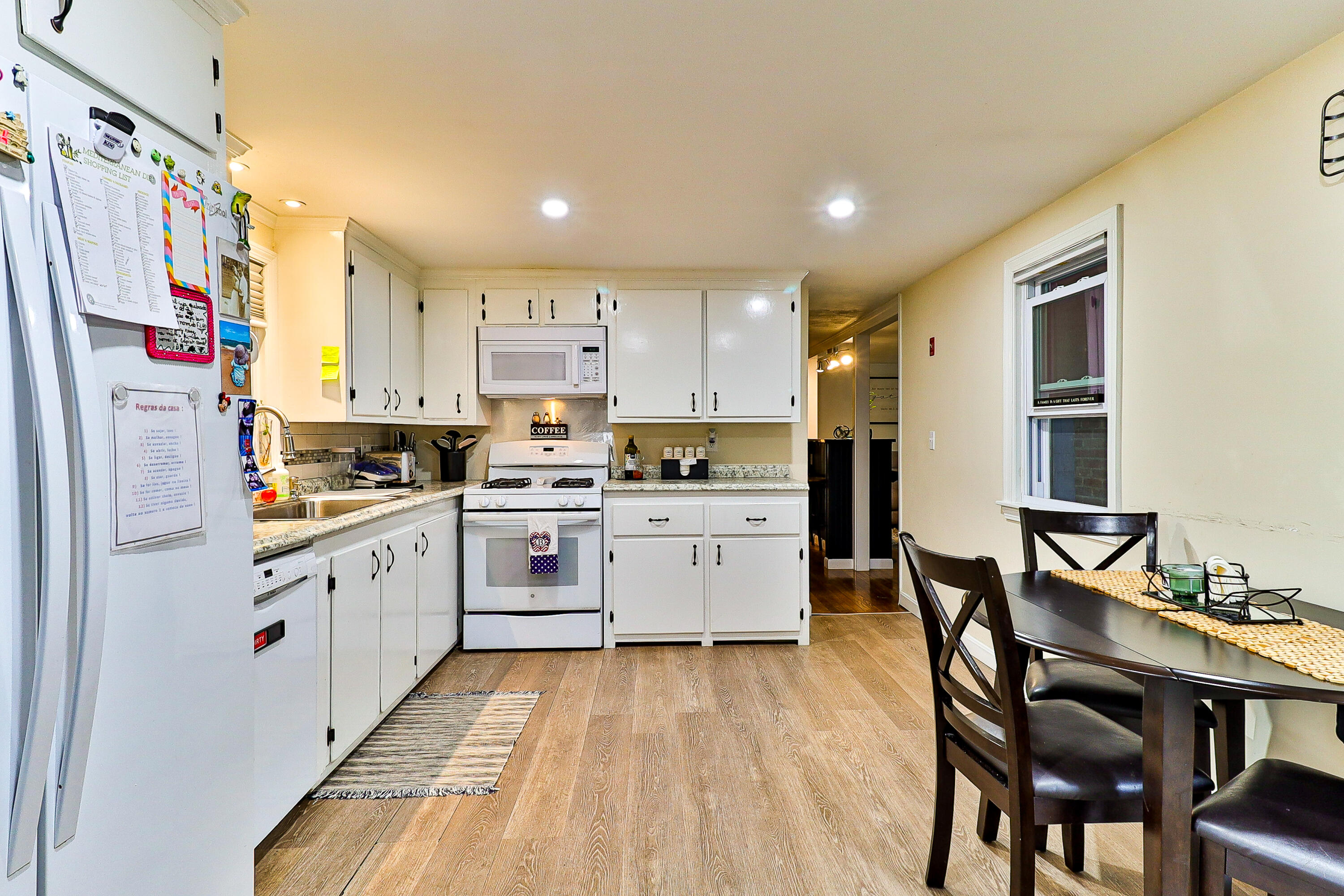 440 Lincoln Rd Extension Barnstable, MA 02601 - Photo 7 of 19 a kitchen with stainless steel appliances granite countertop a white cabinets and wooden floors