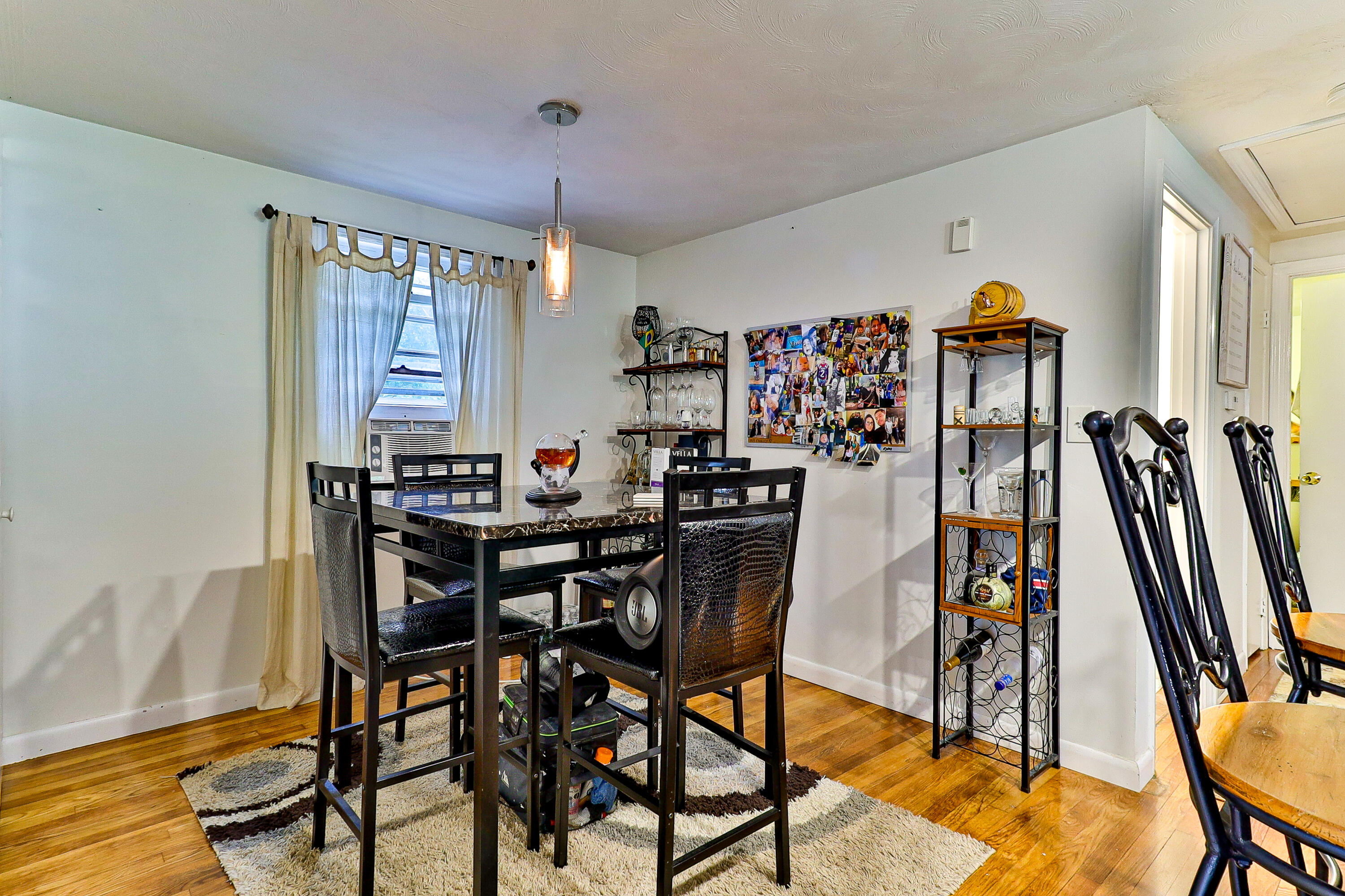 440 Lincoln Rd Extension Barnstable, MA 02601 - Photo 8 of 19 a view of a dining room with furniture and wooden floor