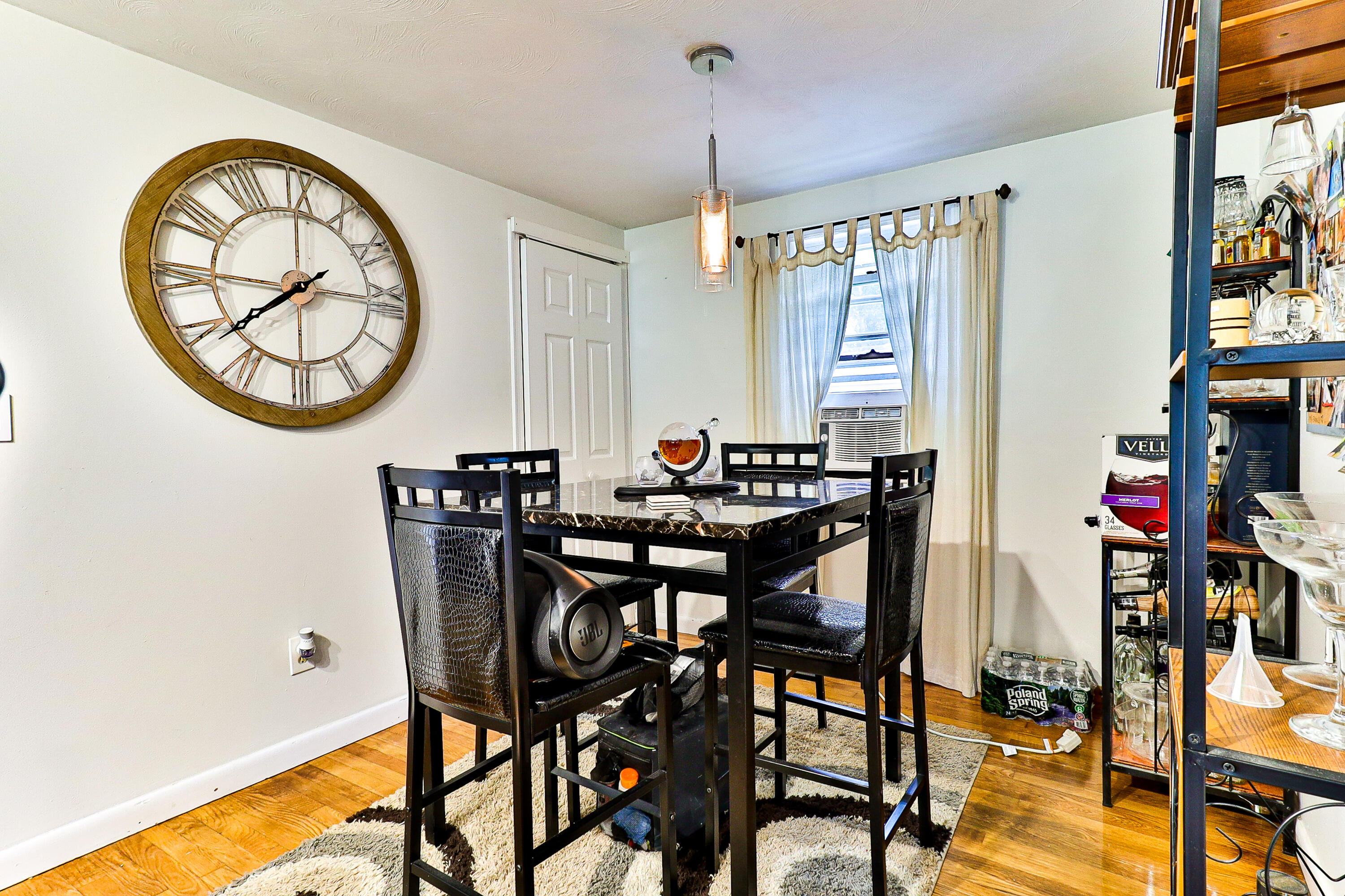 440 Lincoln Rd Extension Barnstable, MA 02601 - Photo 9 of 19 a view of a dining room with furniture and a chandelier
